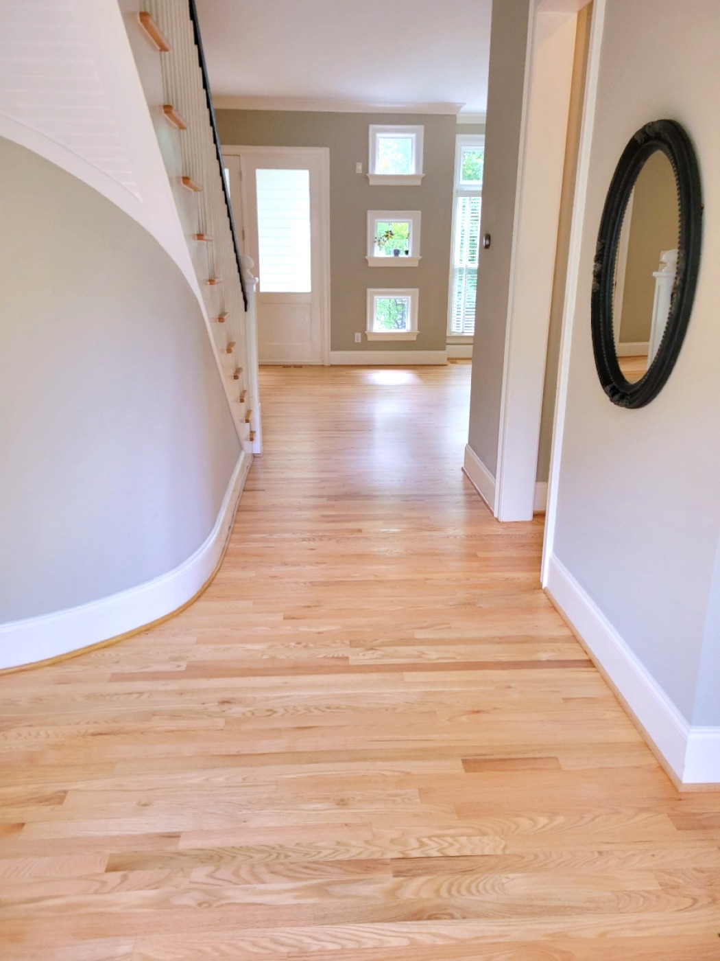Hardwood flooring running through an entry hall