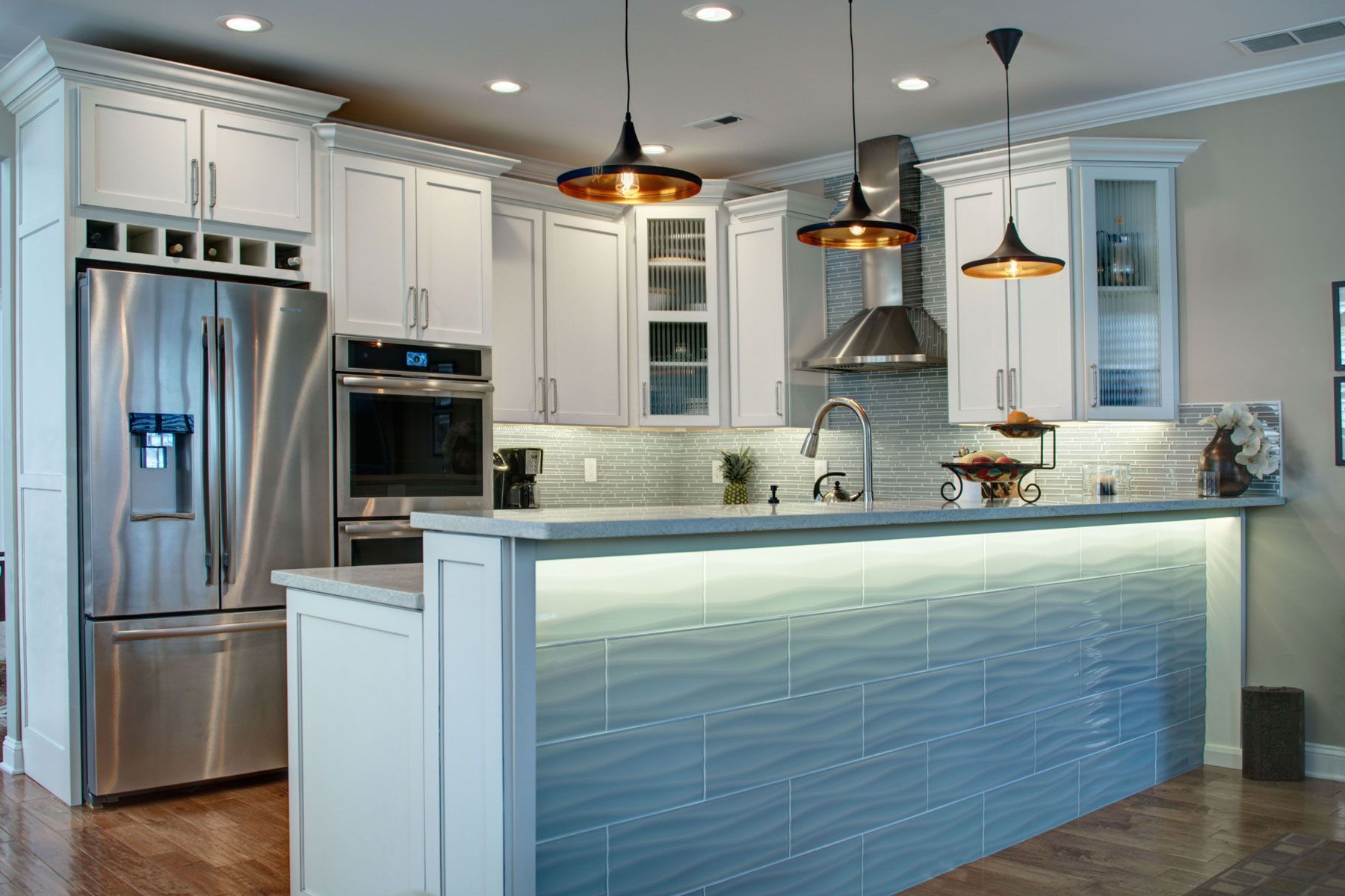 Two-tone kitchen with light blue island cabinets