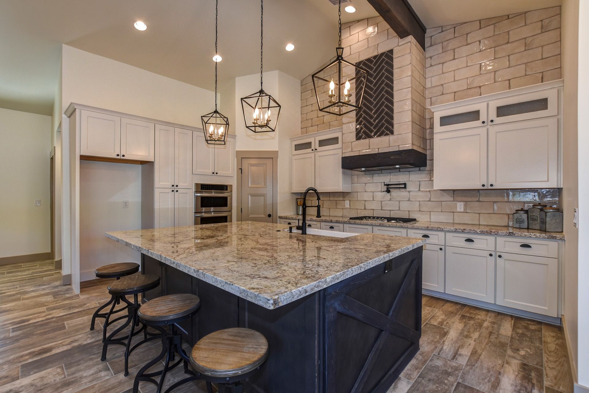 Kitchen with under-lit island and glass tile